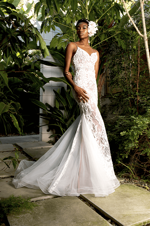 Bride in a sheer mermaid wedding gown w/ embroidery