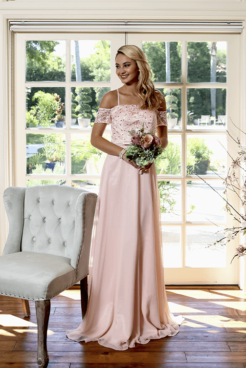 Bridesmaid in a pink off-the-shoulder floor-length dress