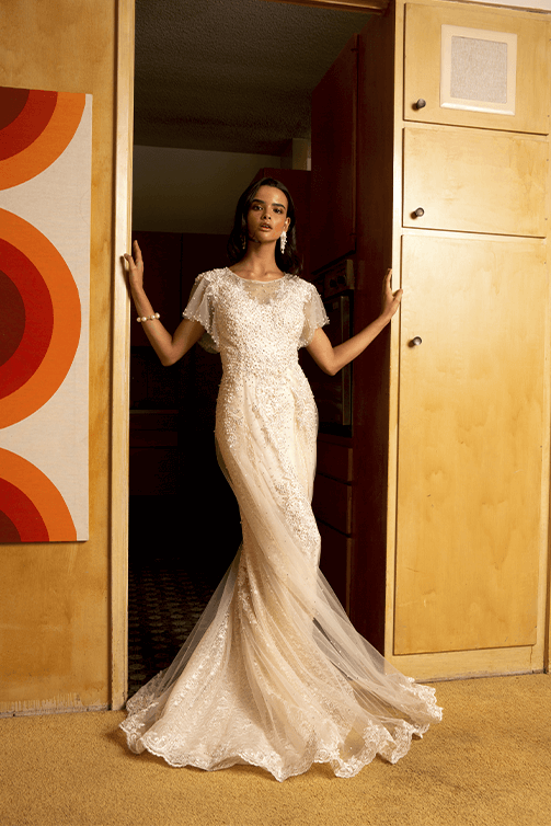 Bride in a sheer mermaid wedding gown w/ embroidery