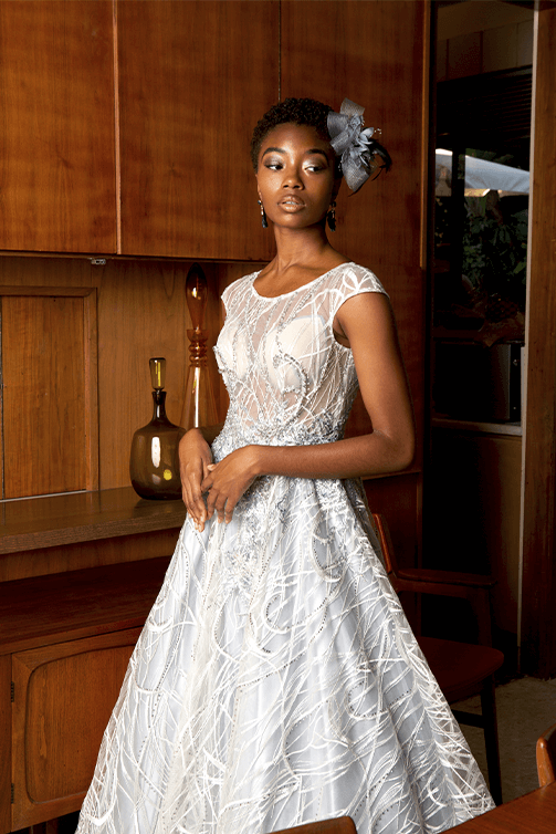 Girl in a white red carpet dress w/ sheer top & cap sleeves