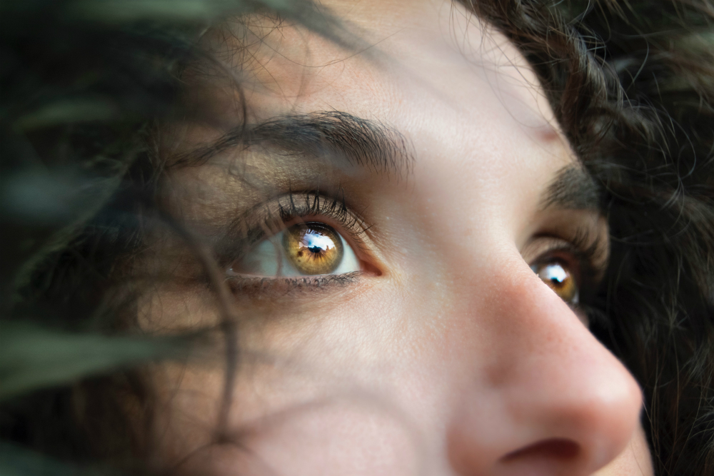 A woman with amber-colored eyes