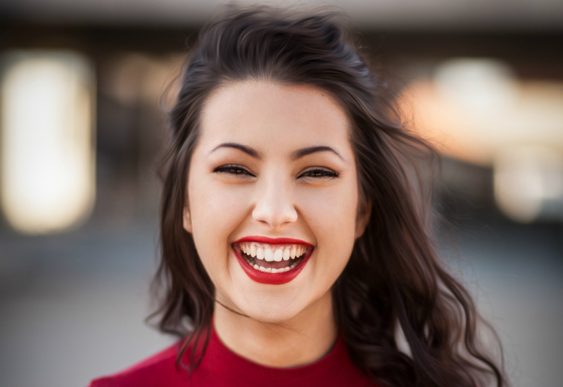 A woman smiling