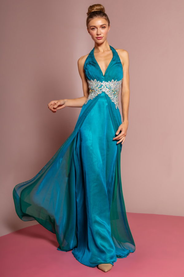 woman in teal v-neck gown