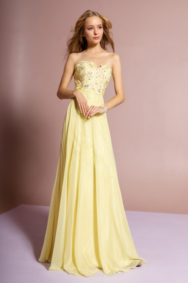 woman in yellow strapless gown