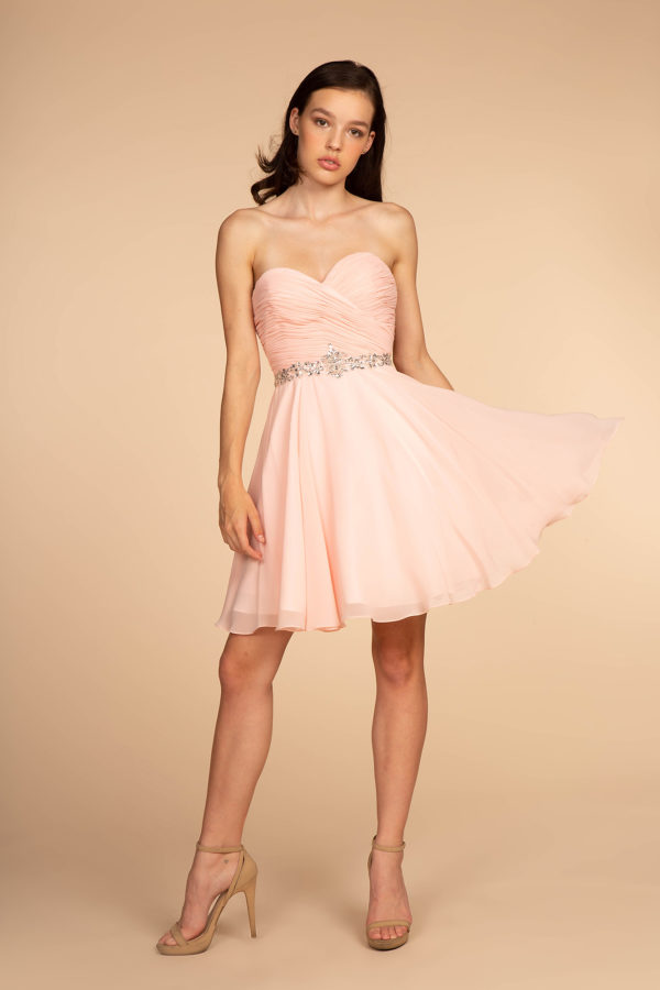 woman in blush cocktail dress