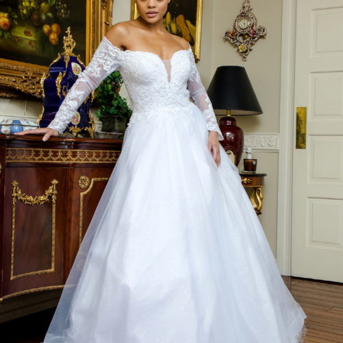 woman in off shoulder long sleeve wedding gown