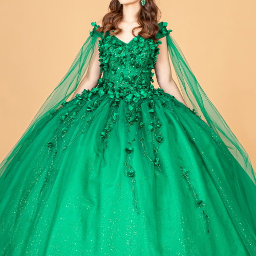 Girl in an emerald green floor-length Quinceanera gown