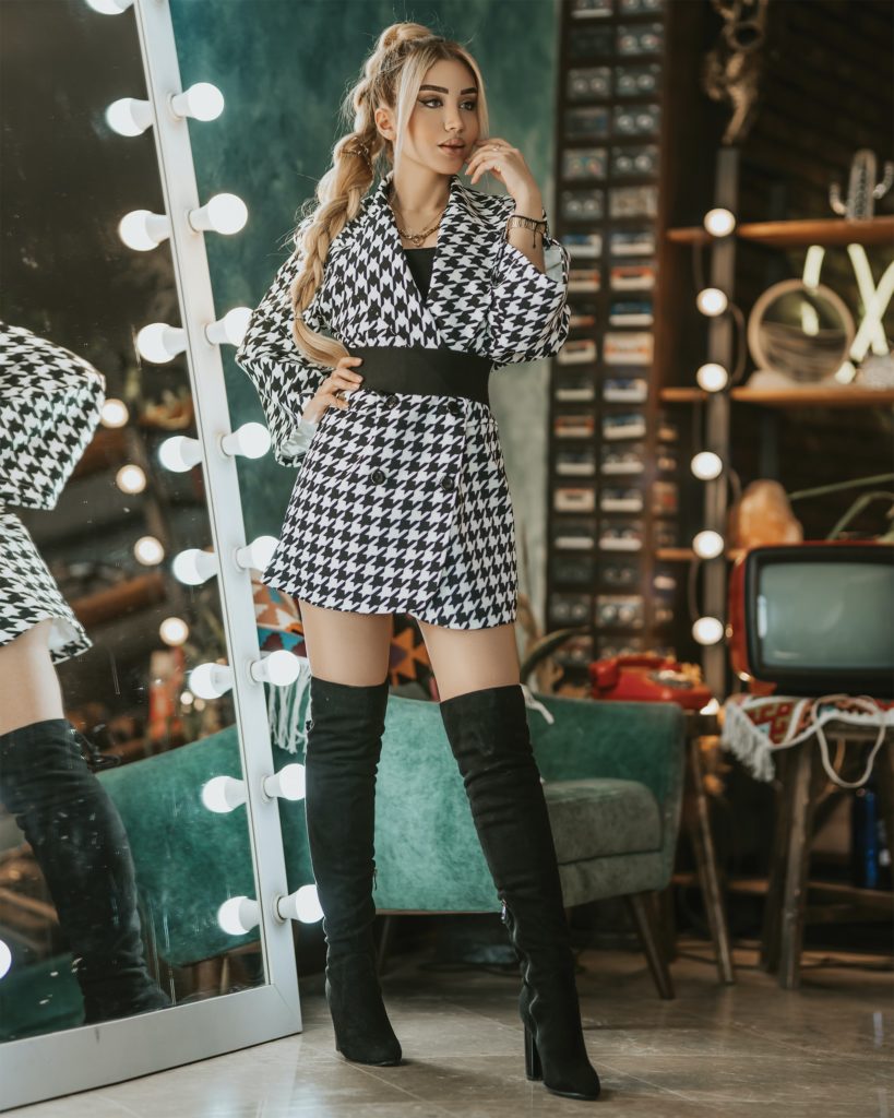 girl in plaid coat and boots
