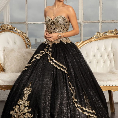 woman in black and gold ballgown
