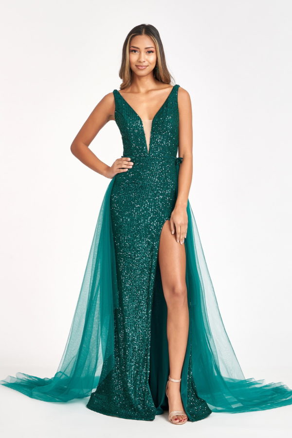 woman in emerald high slit gown