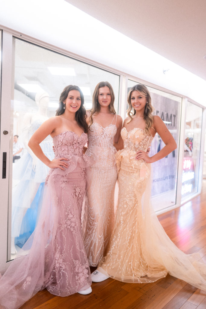 three girls in strapless mermaid dresses