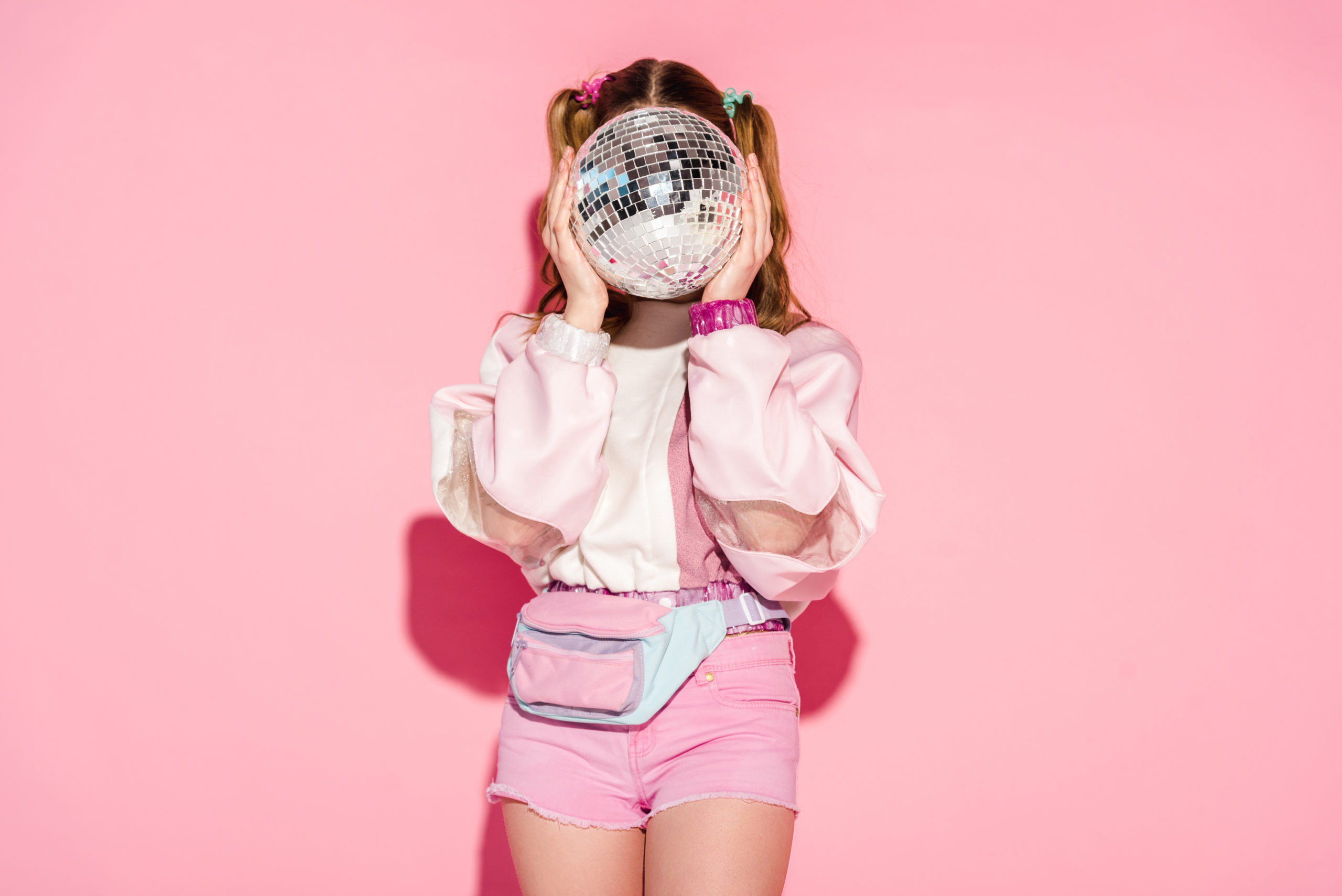 https://glscollective.com/wp-content/uploads/2024/01/girl-covering-face-with-shiny-disco-ball-while-sta-2023-11-27-04-53-54-utc-scaled.jpg