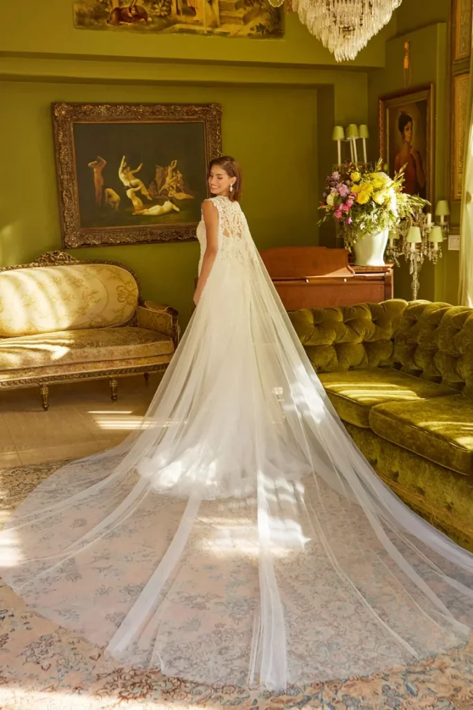 a rear view of a woman in a classy white wedding dress