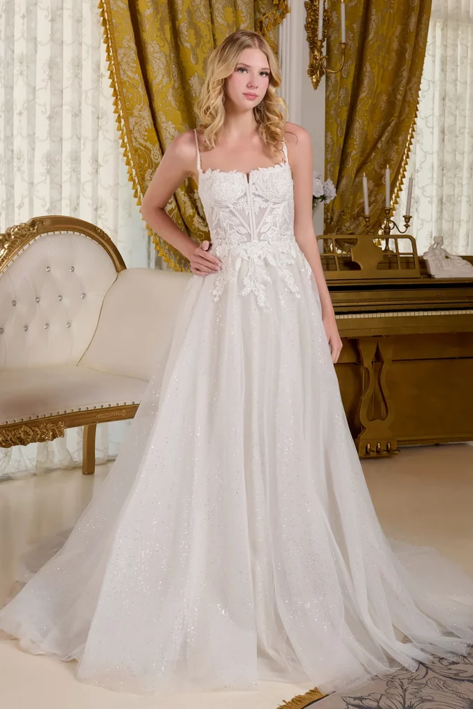 a woman in an embroidered white sequin dress 