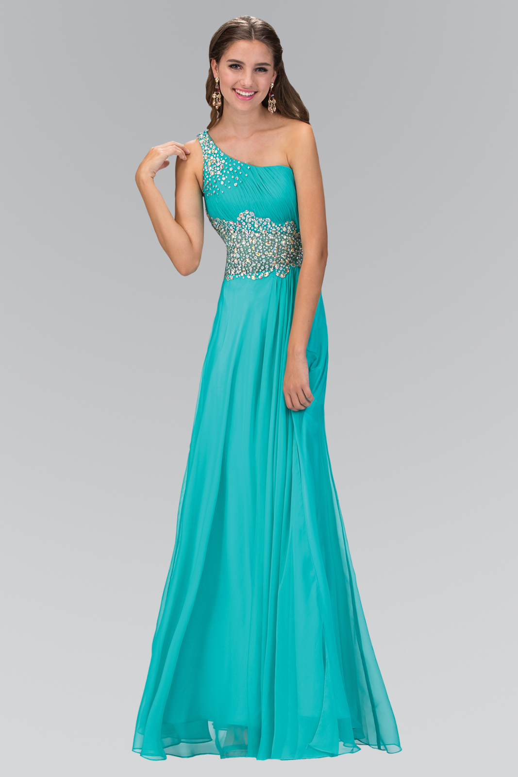 woman in teal asymmetrical gown