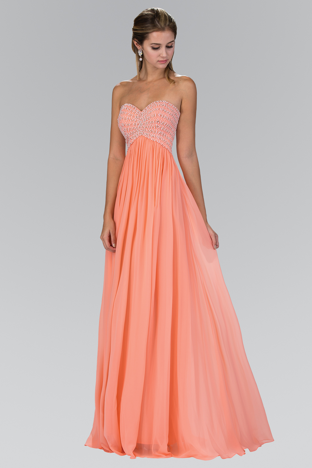 woman in strapless coral gown